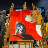 Obraz na sztaludze prezentuje namalowanego psa